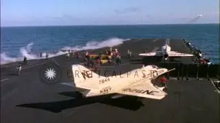 Aircraft take off from the USS Midway (CVA-41) underway and crew watch Napalm bom...HD Stock Footage