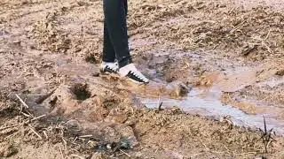Girl losing shoes in mud (Helga li)