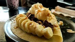 Free Stock Footage - 4K, A boy eating crepe banana brownie