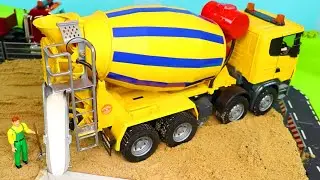 A Concrete Mixer and other Toy Vehicles