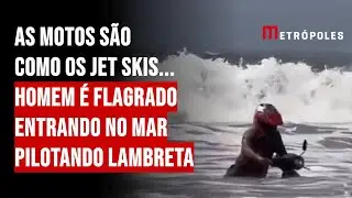 As motos são como os jet skis... Homem é flagrado entrando no mar pilotando lambreta