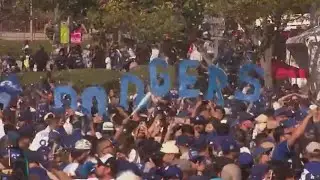 Dodger fans flood DTLA for World Series parade, call out from work, school