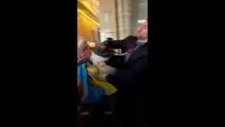 Russian and Ukrainian delegates fight for flag at conference