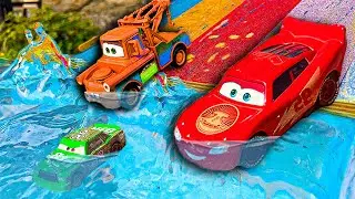 Disney Pixar Cars fall into the water: Lightning McQueen, Chick Hicks, Mack Trucks, Dinoco, Mater