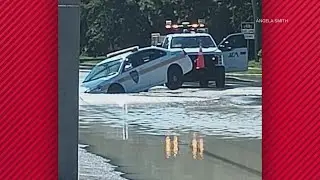 JSO vehicle seen stuck in sinkhole caused by water main break on Jacksonville's Northside