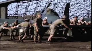 Japanese soldiers push Japanese fighter plane into hangar at Atsugi Airdrome in J...HD Stock Footage