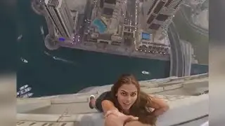 WATCH: Model’s Shocking Photo Shoot From Edge of 73-Story Building