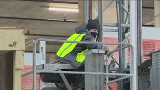 Two Stop Cop City protesters chained to construction equipment in Midtown