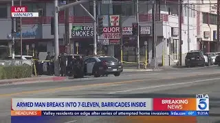 Police respond to armed man barricaded in Los Angeles 7-Eleven store 