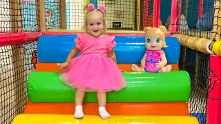 Alice has fun on the indoor playground