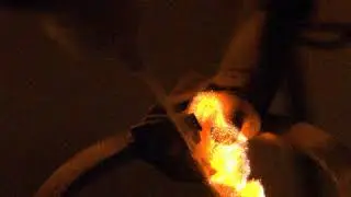 Spark igniting lycopodium powder spray - close up - recorded at high speed