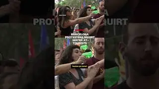 Barcelona protesters squirt water at tourists