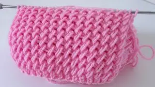 Plump, warm 3D knitting pattern. Knitted pattern of elongated loops for a blanket.