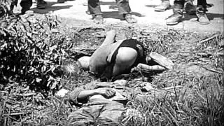 A US Marine fires at and drags a Japanese soldier in Okinawa, Japan during World ...HD Stock Footage